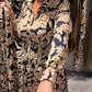 Robe chemise vintage à fleurs avec boutonnage à la taille