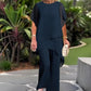 Conjunto encantador de blusa irregular e calça pantalona